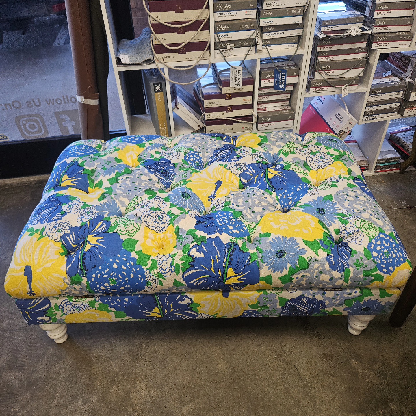 Tufted floral ottoman — classic reupholstery work